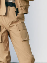 A lady wears cargo pants.